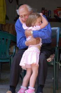 Lucy shares a hug with her friend Al, who has known her family since before she was born.