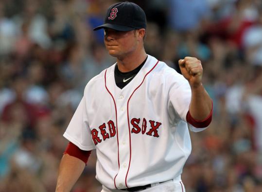 Jon Lester shows his appreciation for a double play that got him out of a bases-loaded bind in the first inning.