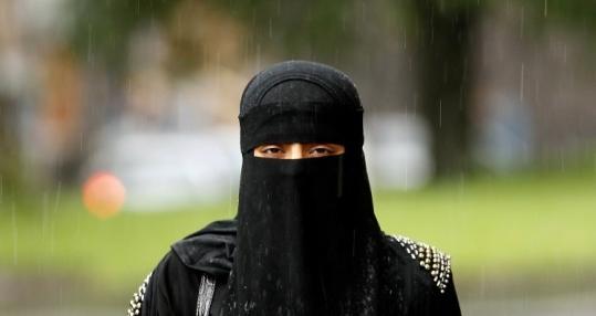 A woman wore a veil yesterday in Blackburn, England. Several European countries have considered banning face veils.