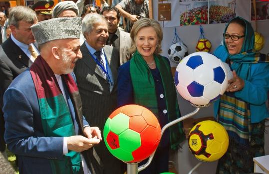 President Hamid Karzai toured a crafts bazaar in Kabul, Afghanistan, with US Secretary of State Hillary Rodham Clinton.