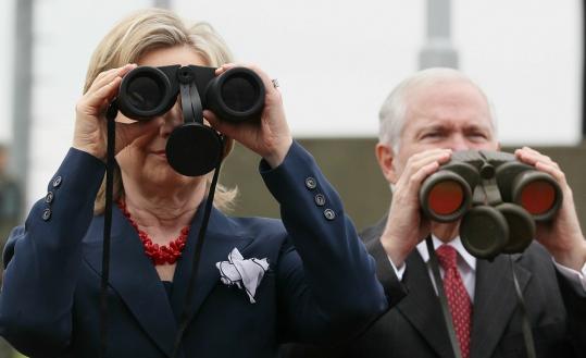 Secretary of State Hillary Rodham Clinton and Defense Secretary Robert M. Gates looked north yesterday from the DMZ.