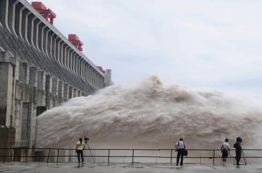 A stream of water shot out after being released Tuesday from the Three Gorges Dam’s floodgates in Yichang, China.