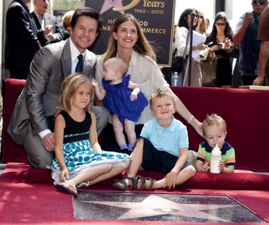 Boston-bred movie star Mark Wahlberg (with his wife, Rhea Durham, and their children, from left, Ella, Grace, Michael, and Brendan), was honored with a star on the Hollywood Walk of Fame yesterday.