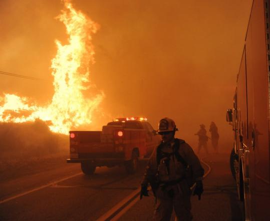 Firefighters prepared to battle the flames as a fast-moving wildfire approached Palmdale, Calif., on Thursday.