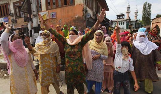 Muslim women shouted yesterday in Srinagar, India. Protests erupted despite tighter security meant to quell demonstrations.