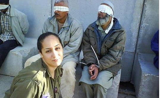 Eden Aberjil posted pictures on Facebook of herself, in uniform, posing with Palestinian detainees. The Israeli military and Palestinian officials have condemned the photos.