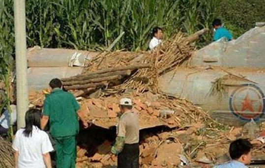 A photo released by a South Korean news agency, and reportedly taken from a Chinese website, showed a small aircraft bearing North Korean markings crashed in a Chinese field.