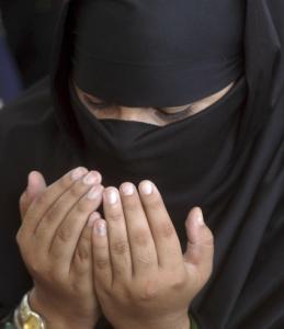 Some Muslim women wear a burqa as a sign of modesty.