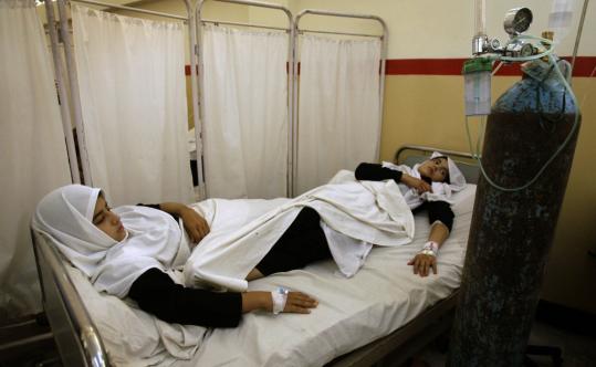 Two students were treated at a hospital in Kabul yesterday. Nearly 50 students and teachers at a high school were taken to hospitals after falling ill with breathing problems and nausea.