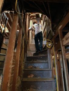 A view of a stairway in the 1835 house next to the Paul Revere House that is being restored.