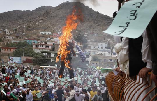 In Kabul yesterday, Afghans burned an effigy of a Florida pastor who plans to burn copies of Islam’s sacred book on Sept. 11.