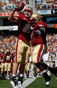 Chris Pantale (left) celebrates his first-quarter TD against Weber State with Thomas Claiborne.
