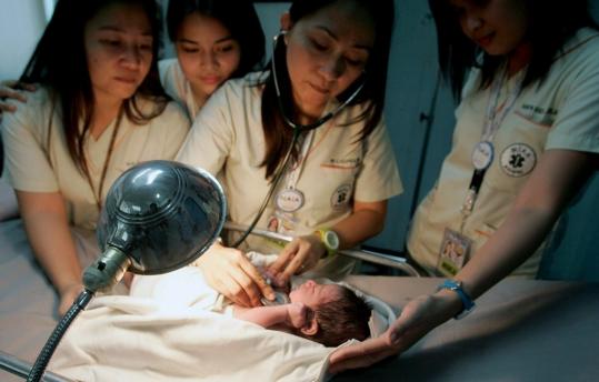 Airport doctors in Manila attended to a newborn boy found when a security officer noticed something moving in a garbage bag reportedly unloaded from a Gulf Air plane from Bahrain.