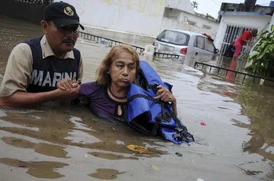 Veracruz, Mexico, was dealing with flooding and landslides following Hurricane Karl as Hurricane Igor lashed Bermuda.