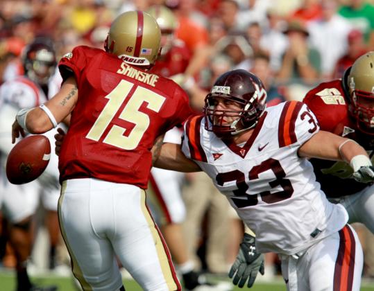 Virginia Tech defensive end Chris Drager strips the ball from BC quarterback Dave Shinskie.