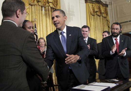 President Obama shook hands with attendees during a ceremony yesterday to sign the Small Business Jobs Act.