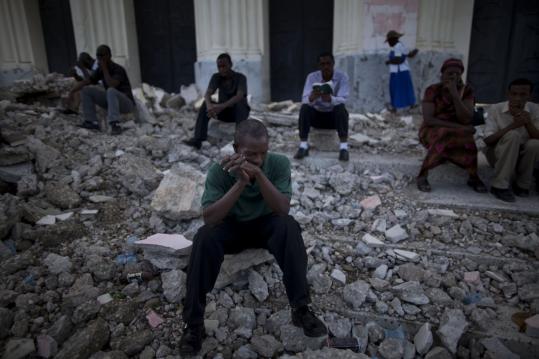 Catholics prayed amid the rubble of the Notre Dame cathedral during Mass in Port-au-Prince, Haiti, on Sunday.