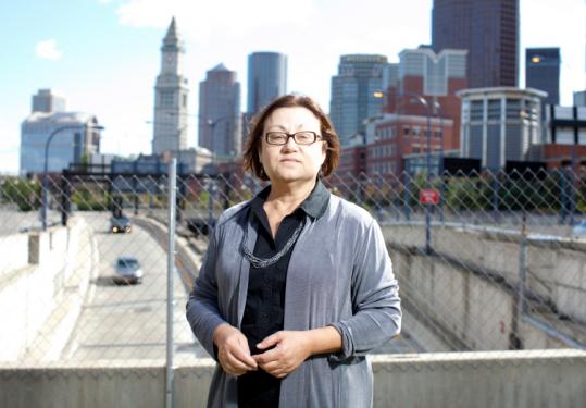 Mary Beaudry, Boston University professor, stood in front of the site of what was once a Boston brothel. Uncovered artifacts include a spittoon, carved bone toothbrushes, and a cosmetics jar.