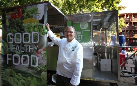 Joseph Krupczynski and the “Movable Feast’’ food cart.