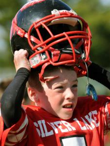 Sean Waters of the Silver Lake Division 2 Mites puts on his helmet before playing Hanover recently.