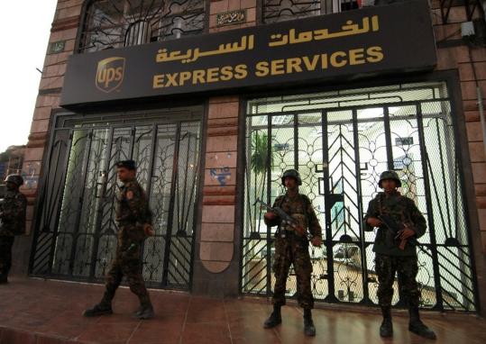 Yemeni security officials patrolled outside a UPS package delivery branch in Sanaa yesterday after packages containing bombs were pulled from US-bound planes on Friday.