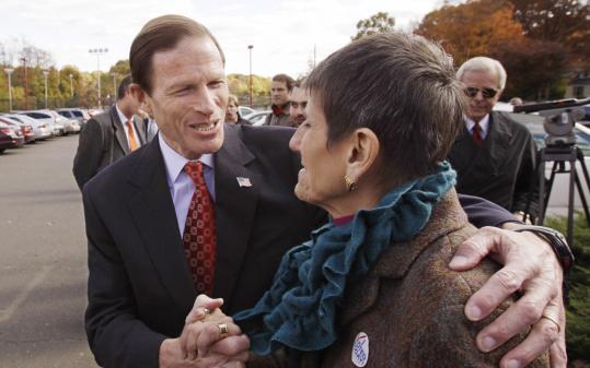 Richard Blumenthal, who won a Senate seat, spoke to US Representative Rosa DeLauro, who was reelected, in New Haven, Conn.