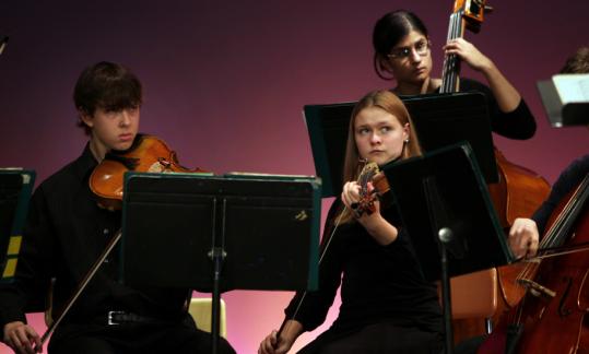 Members of the Arlington High School Honors String Orchestra performing at the Nov. 7 memorial service for music teacher Frank Roberts in Waltham.
