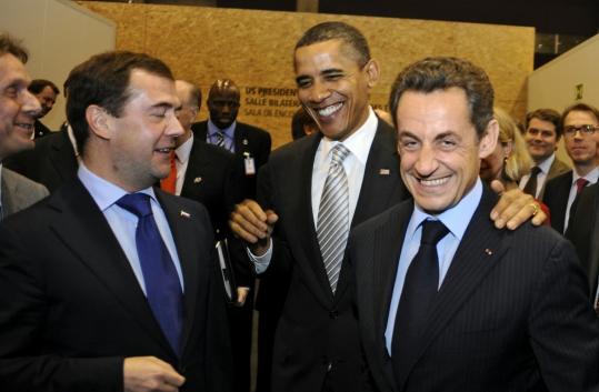 President Obama shared a joke with President Dmitry Medvedev (left) of Russia and President Nicolas Sarkozy of France yesterday at a summit of NATO allies in Portugal.