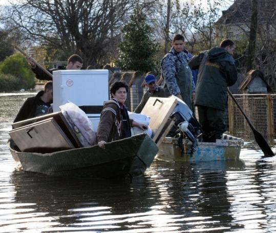 Montenegrins evacuated their flooded homes yesterday, as the worst flooding in a century in the Balkans continued.