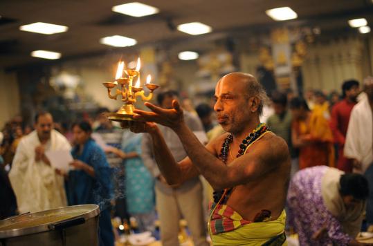 Krishna Bhatta led a ceremony last month at the Sri Lakshmi temple in Ashland. Leaders of the temple (below) hope to add a new wing next spring.