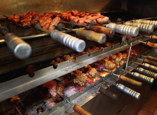 Beef, lamb, pork, chicken, and sausage are grilled over coals at Gauchao Brazilian Cuisine in Somerville.