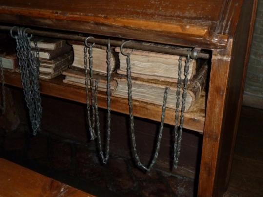 The handwritten volumes are chained to the desks, as they have been forever, at the Malatestiana Library in Cesena, Italy.