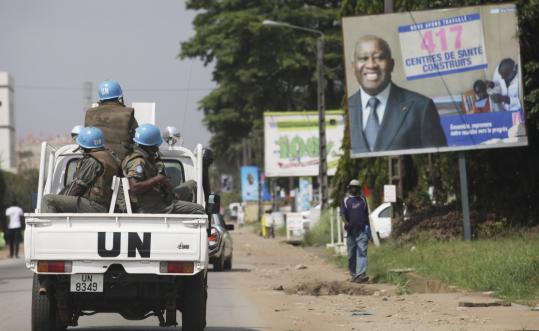 A United Nations patrol in Abidjan passed a billboard for Ivory Coast’s president, Laurent Gbagbo, who has fought leaving office after an election that international observers said he lost.