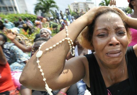 Christian women attended a prayer for peace in Abidjan, Ivory Coast. Incumbent leader Laurent Gbagbo warned that a foreign plot was pushing the country toward civil war.
