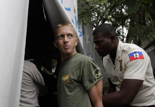 Paul Waggoner of Nantucket was escorted by police to court in Port-au-Prince, Haiti, on Dec. 15 on allegations of kidnapping an infant. Charges against the relief aid worker were dropped.