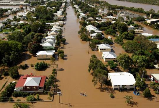 Flood water spread through the low-lying suburb of Depot Hill in Rockhampton, in eastern Queensland, Australia. Evacuated families may not return home for weeks.