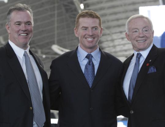 A 5-3 record as interim Cowboys coach convinced owner Jerry Jones (right) and his son, Stephen (left), to hire Jason Garrett.