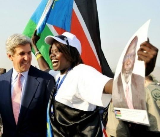 Senator John Kerry was greeted by a Sudanese woman yesterday in Juba.