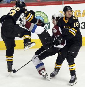 The Bruins’ Brad Marchand crushes Matt Duchene in the first period, although he takes out teammate Nathan Horton, too.