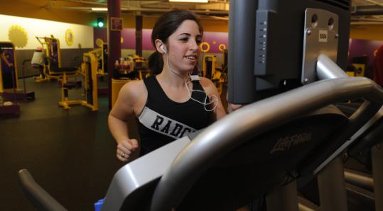 Amanda Deutsch worked out at Planet Fitness in Cambridge's Porter Square, where she pays based on her ability to stick to her exercise schedule.