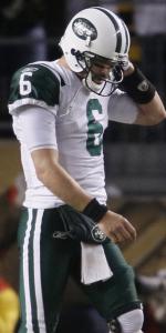 Jets quarterback Mark Sanchez walks dejectedly off the field near the end of the AFC title game.