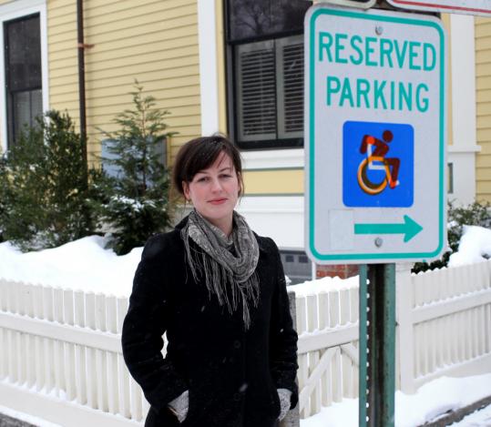 Cambridge artist Sara Hendren is sticking her modified handicapped symbol over the standard sign image.