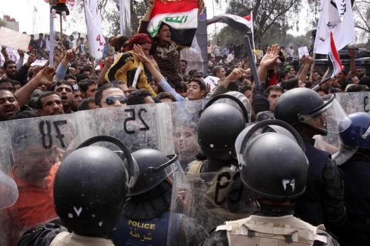 Antigovernment protests, such as this one Friday in Basra, killed 14 across Iraq and prompted Prime Minister Nouri al-Maliki to take steps to respond to the people’s call for change.