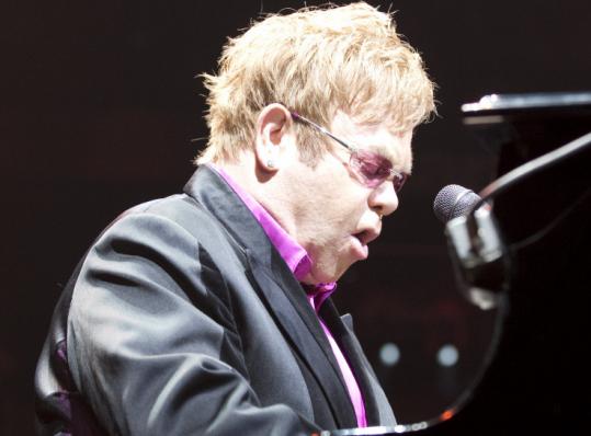 Elton John was emphatically energetic Saturday night at the DCU Center in Worcester, playing hours of favorites and hits.