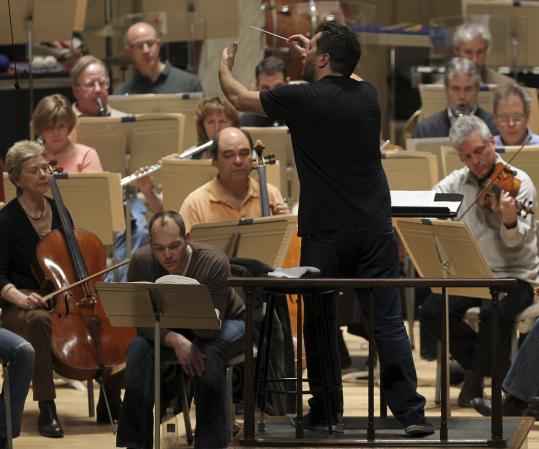Composer-conductor Thomas Adès recently rehearsing with the BSO. Adès, who earlier this month celebrated his 40th birthday, has been under intense scrutiny since the early 1990s.