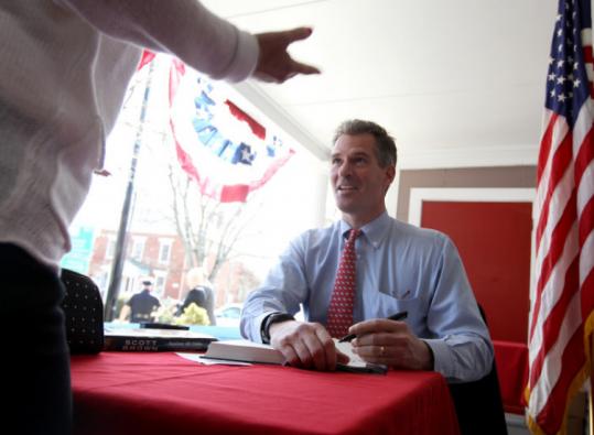 Senator Scott Brown, at a book signing yesterday at the Colonial Inn in Concord, called the budget plan “a good first step.’’ The Republican said he would study the bill.
