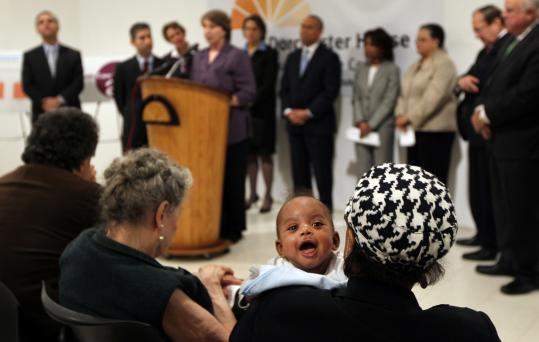 Cindy Williams held her grandson Julian Tyce Crowder at an event marking the fifth anniversary of the Massachusetts health care law yesterday in Dorchester.