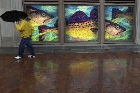 A passerby on Atlantic Avenue in Boston could not have picked a more fitting mural to stroll past yesterday as heavy rainfall hit the metropolitan area.