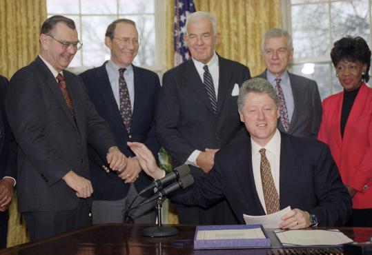 Representative Harold Volkmer (left), Democrat of Missouri, joined other lawmakers as President Clinton signed legislation in the Oval Office in 1994. Mr. Volkmer died Saturday at 80.