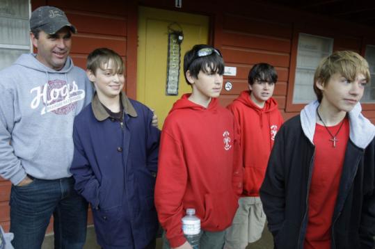 Scouts Ian Fuslier (left to right), Stephen Miller, Dylan Docte, and Caleb Stutes were joined yesterday by Pastor Graig Cowart. Parents had waited with Cowart for news of their sons.